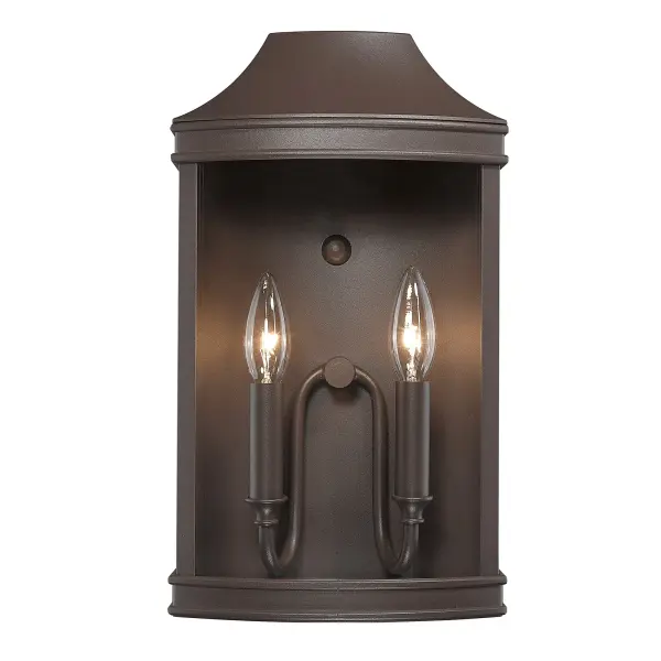 The Cohen outdoor wall sconce combines traditional elegance with rugged durability. Its textured bronze finish and clear glass design create inviting illumination for entryways, patios, and garage areas. - alternate view