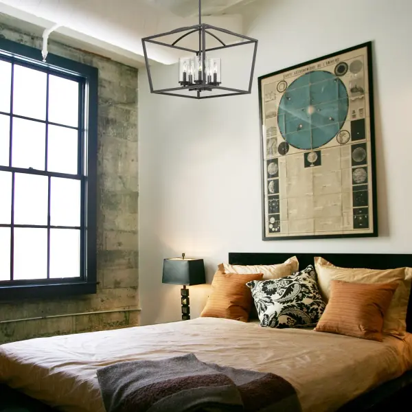The Golden Lighting Mercer chandelier combines classic transitional design with industrial touches through its matte black finish and distinctive seeded glass shades. Perfect for dining rooms and foyers, this 5-light fixture offers adjustable height and versatile styling that complements both traditional and contemporary interiors. - alternate view