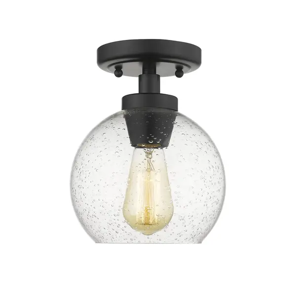 Introduce clean, modern style into your home with the Golden Lighting Galveston 1-light Flush Mount in Matte Black and Seeded Glass. Featuring a glass shade and a matte black finish, it creates a refined atmosphere. The seeded glass shade offers artisan charm with its textured surface, infused air bubbles, and an elegant glossy finish. This unique design captures light beautifully, casting a warm, inviting glow in any room. The matte black finish is timeless and versatile, complementing a variety of decor styles from minimalistic to industrial. This flush mount is damp location rated, making it suitable for covered spaces like bathrooms and laundry rooms. Overall dimensions are 7.25"W x 9"H x 7.25"D, requiring 1 E26 Medium base bulb (not included, Max 60 wattage per bulb). Enhance your home's ambiance with this stylish yet functional fixture, ideal for hallways, closets, or compact areas.