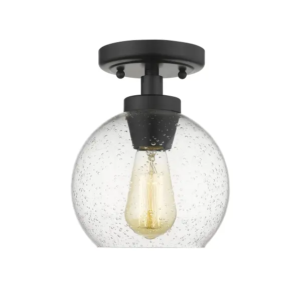 The Galveston flush mount delivers clean modern style in a compact 7.25" profile. Its seeded glass shade with textured bubbles creates warm, inviting light while the matte black finish offers timeless versatility across decor styles.
