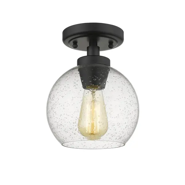 Introduce clean, modern style into your home with the Golden Lighting Galveston 1-light Flush Mount in Matte Black and Seeded Glass. Featuring a glass shade and a matte black finish, it creates a refined atmosphere. The seeded glass shade offers artisan charm with its textured surface, infused air bubbles, and an elegant glossy finish. This unique design captures light beautifully, casting a warm, inviting glow in any room. The matte black finish is timeless and versatile, complementing a variety of decor styles from minimalistic to industrial. This flush mount is damp location rated, making it suitable for covered spaces like bathrooms and laundry rooms. Overall dimensions are 7.25"W x 9"H x 7.25"D, requiring 1 E26 Medium base bulb (not included, Max 60 wattage per bulb). Enhance your home's ambiance with this stylish yet functional fixture, ideal for hallways, closets, or compact areas. - alternate view