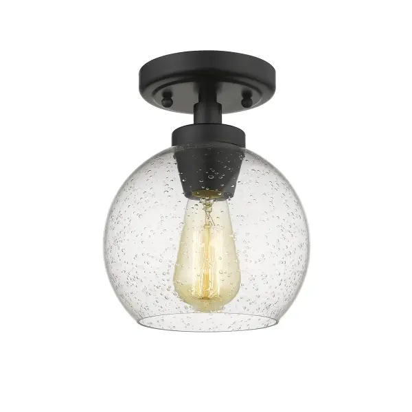 The Galveston flush mount delivers clean modern style in a compact 7.25" profile. Its seeded glass shade with textured bubbles creates warm, inviting light while the matte black finish offers timeless versatility across decor styles. - alternate view