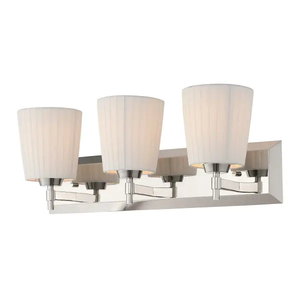 The Golden Lighting Brilia 3-Light Vanity offers a sophisticated blend of structure and softness through its clean-lined metal framework and tailored shade design. Three pleated linen shades are supported by streamlined arms extending from a rectangular backplate, creating a balanced silhouette that feels both classic and contemporary. The finely woven fabric gently diffuses light, producing a warm, even glow while minimizing glare. Finished in Polished Nickel, the electroplated metal features a bright, mirror-like sheen with subtle warmth that adds polished refinement. Measuring 24"W x 9.25"H x 6.13"D, this vanity is ideal for bathrooms and powder rooms. Damp-location rated for added flexibility, it requires three E26 medium base bulbs (not included), each up to 60 watts.