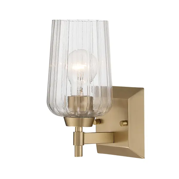The Yep by Golden Lighting Brilia 1-Light Wall Sconce delivers a refined balance of classic form and modern detailing. Clean metal lines and a compact rectangular backplate create a tailored silhouette, while the clear fluted glass shade introduces subtle texture and architectural interest. Finished in Brushed Champagne Brass, the electroplated surface features a soft satin sheen with warm undertones that elevate both modern and transitional interiors. The vertically ribbed glass softly refracts light for bright, even illumination with crisp clarity. Measuring 4.88"W x 9.25"H x 6.13"D, this sconce is ideal for hallways, bathrooms, stairways, bedrooms, and entryways. Damp-location rated for covered spaces, it uses one E26 medium-base bulb (not included) for flexible lighting options. Collection: Brilia Finish: Brushed Champagne Brass Glass: Fluted Glass Width: 4.88" Height: 9.25" Weight: 2.20 lb Extension from Wall: 6.13" Canopy: 24"W x 4.87"H x 0.75"D Number of Bulbs: 1 Maximum Wattage: 60.00 W Bulb Type: A19 Bulb Base: E26 Dimmable Voltage: 120.00 V Country of Origin: China Safety Listing: ETL Manufacturer Warranty: 1 Year Limited