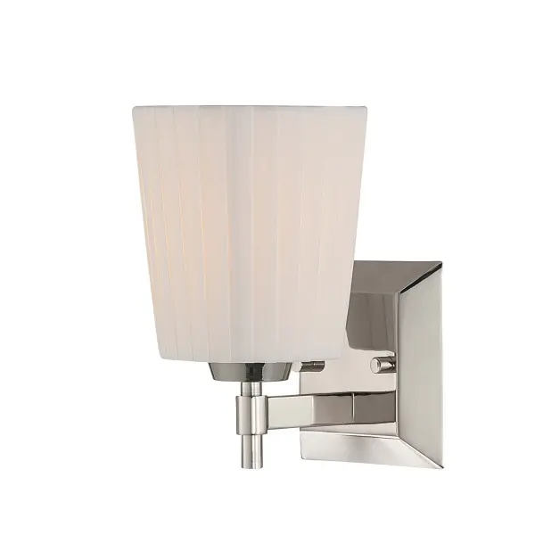 The Golden Lighting Brilia 1-Light Wall Sconce delivers understated elegance through refined materials and clean-lined construction. Finished in Polished Nickel, the metal framework provides a bright, reflective surface that complements both traditional and contemporary interiors. The pleated linen shade introduces tailored texture and gently diffuses light, creating a warm, inviting glow with subtle shadowing. Perfect for bathrooms, bedrooms, hallways, and living areas, this wall sconce balances decorative detail with functional lighting. Damp-location rated and compatible with one E26 medium-base bulb (not included), it offers flexible illumination options. Measuring 4.88"W x 9.25"H x 6.13"D, the Brilia wall sconce adds timeless sophistication and soft ambient light to any space.