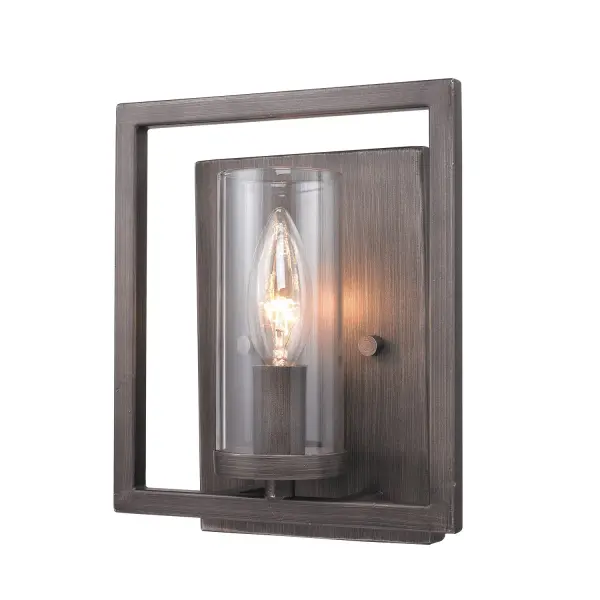 The Marco Wall Sconce combines industrial charm with modern sophistication through its gunmetal bronze finish and clear glass shade. Perfect for smaller spaces, this damp-rated fixture delivers brilliant illumination while showcasing the bulb as part of the design aesthetic.