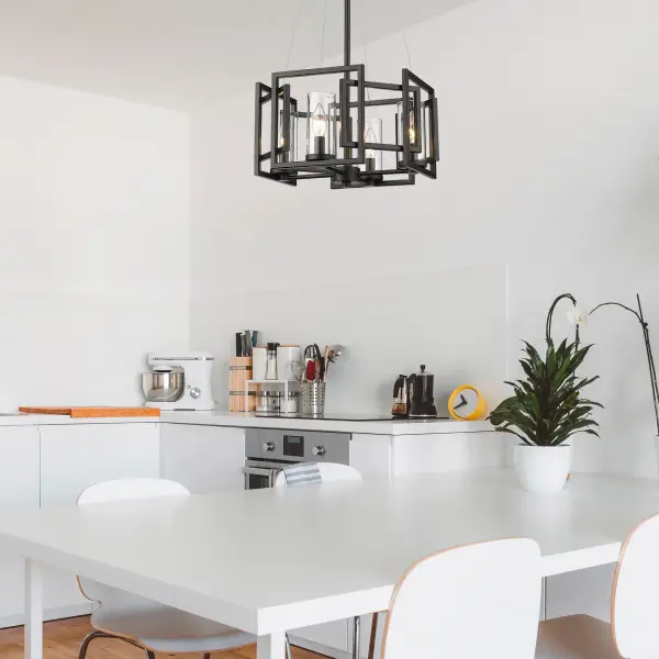The Marco 4-light semi-flush mount combines contemporary elegance with practical versatility. Its clear glass shade and matte black finish create a refined aesthetic that complements various decor styles while providing excellent light output. - alternate view