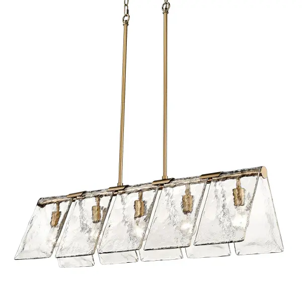The Serenity 5-Light Island Light combines modern brass elegance with distinctive hammered water glass shades that create captivating light refraction. Its generous 37.88-inch width and adjustable height make it ideal for kitchen islands and dining tables, while the muted brass patina adds timeless sophistication to contemporary and transitional interiors.