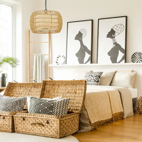 The Everly 4-light pendant beautifully combines handwoven natural rattan with a sleek matte black frame, creating an organic yet refined statement piece. Its adjustable height and damp location rating make it versatile for various spaces. - alternate view