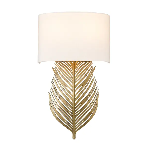 The Cay 2-Light Wall Sconce combines artisanal craftsmanship with functional beauty. Its hand-brushed Vintage Fired Gold finish and ivory linen shade create a warm, inviting glow perfect for intimate spaces.