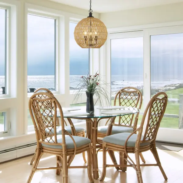The Florence pendant brings breezy, coastal charm with its hand-woven natural raphia rope shade and sleek matte black frame. Perfect for creating a relaxed yet sophisticated atmosphere in dining rooms and living spaces. - alternate view
