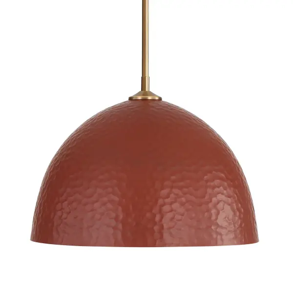 The Shepard pendant combines vintage-inspired hammered metal with modern brass elegance, creating warm, earthy ambiance. Its adjustable cord and damp location rating make it versatile for various spaces from kitchens to covered porches.