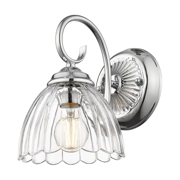 The Audra wall sconce combines polished chrome elegance with clear glass for brilliant, unobstructed light. Damp-rated for bathrooms and covered porches, its compact 6.88" width fits tight spaces while delivering sophisticated style.