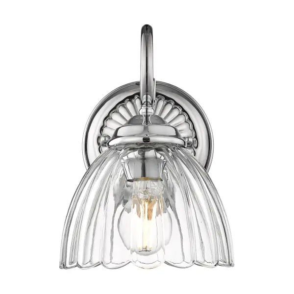 The Audra wall sconce combines polished chrome elegance with clear glass for brilliant, unobstructed light. Damp-rated for bathrooms and covered porches, its compact 6.88" width fits tight spaces while delivering sophisticated style. - alternate view