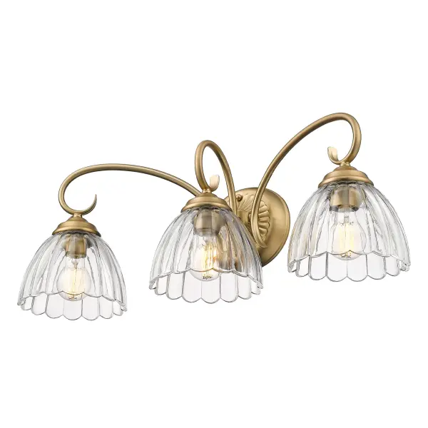 The Audra 3-Light Vanity combines sophisticated brushed champagne brass with clear glass shades for a luxurious bathroom upgrade. Damp-rated for bathroom use, this 25.5-inch fixture provides ample illumination while adding warmth and elegance to modern interiors.