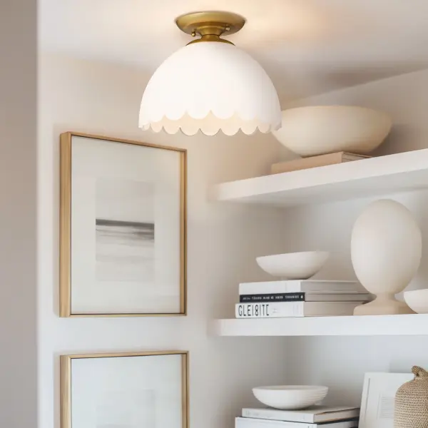 The Dorinda semi-flush mount combines transitional sophistication with practical functionality. Its brushed champagne brass finish and opal glass shade create a soft, welcoming glow perfect for mid-height ceilings. - alternate view