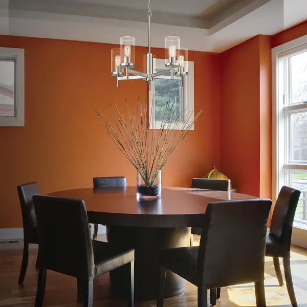 The Winslett 5-light chandelier blends classic pewter finish with clear ribbed glass shades for sophisticated lighting. Its adjustable height and sloped ceiling compatibility make it versatile for various spaces. - alternate view