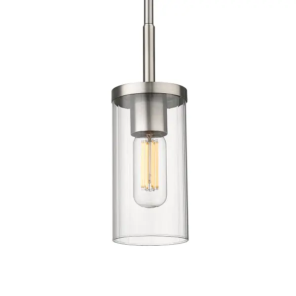The Winslett pendant combines timeless pewter finish with textured ribbed glass for soft, inviting illumination. Its convertible design allows installation as pendant or semi-flush mount with adjustable height, making it ideal for various ceiling heights and room sizes.