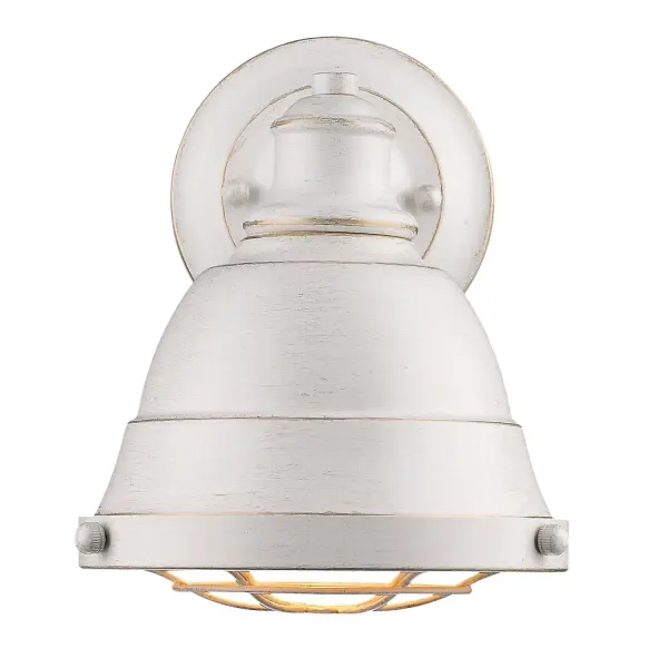 The Bartlett vanity light combines industrial style with traditional elegance through its hand-brushed French White finish with gold undertones. Damp-rated for bathroom use, this compact fixture delivers rustic charm in a small footprint. - alternate view