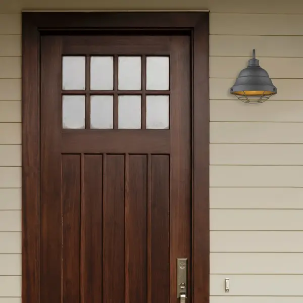 The Bartlett outdoor wall sconce combines factory-inspired design with practical outdoor performance. Its Natural Black finish offers a softer, organic alternative to traditional black, while the wet location rating ensures reliable performance in all weather conditions. - alternate view