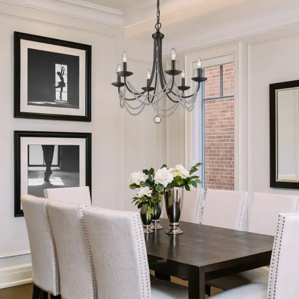 The Mirabella chandelier combines contemporary matte black framing with draped beaded glass swags for a stunning glam aesthetic. Its 6-light design provides ample illumination while the delicate glass details add sparkle and visual interest to any space. - alternate view