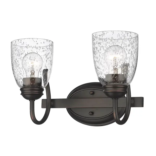 The Parrish 2-Light Vanity combines vintage charm with modern functionality. Its seeded glass shades create a warm, sparkling glow while the rubbed bronze finish adds rich depth that complements multiple decor styles.