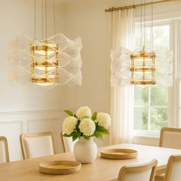 The Vetrina 3-tier pendant combines modern design with exceptional LED performance, delivering 5598 lumens of warm illumination through clear acrylic tiers. Its electroplated light gold finish adds subtle champagne sophistication. - alternate view