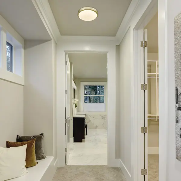 Bring modern elegance into your home with the Golden Lighting Gabi Integrated LED 10in Flush Mount. Featuring an opal glass shade and a Brushed Champagne Brass frame, it creates a welcoming atmosphere. The opal glass shade is designed to diffuse light evenly, providing a soft, glare-free glow. Timeless and elegant, it enhances the beauty of your space. The Brushed Champagne Brass finish offers understated sophistication, blending the warmth of brass with the softness of silver. Its refined texture catches the light beautifully, adding a touch of contemporary style. Ideal for low ceilings in hallways, closets, laundry areas, bathrooms, and more, this fixture is Damp Location Rated, suitable for covered and semi-enclosed spaces with occasional moisture. Overall Dimensions: 10"W x 2.88"H x 10"D. It features integrated LED technology that provides 960 rated lumens and a 3000K CCT for a warm glow. Elevate your home with this stylish fixture that perfectly balances functionality and modern design. - alternate view