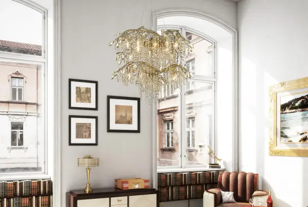 The Autumn Twilight chandelier brings organic beauty indoors with hand-forged branch-like arms and cascading crystal leaves. Its Mystic Gold finish adds warmth and character, while 18 lights provide ample illumination for grand spaces. - alternate view