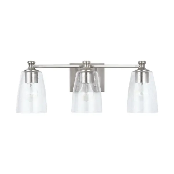 The Myles 3-Light Vanity combines clean lines with a brushed nickel finish for a sophisticated bathroom lighting solution. Its 23-inch width makes it ideal for medium-sized vanities and mirrors.