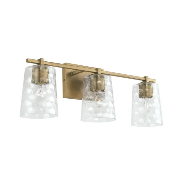 The Burke 3-Light Vanity combines timeless aged brass finish with clean contemporary lines, delivering sophisticated illumination for medium-sized bathrooms. Its 24-inch width provides balanced lighting coverage.