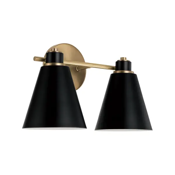 The Bradley 2-Light Vanity combines aged brass warmth with modern black accents in a compact 15-inch design. Perfect for smaller bathrooms and powder rooms, this transitional fixture delivers quality lighting with designer style.