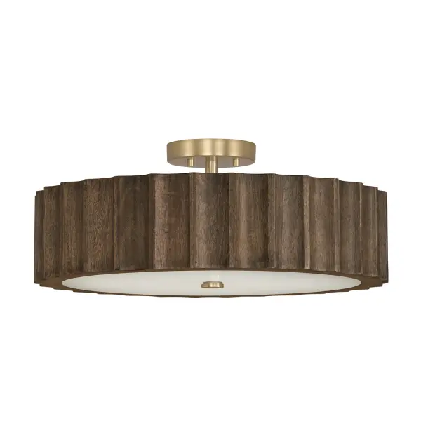 The Cody 4-Light Semi-Flush combines transitional styling with a sophisticated matte brass finish. Its 20-inch width and low 8.25-inch profile make it ideal for standard ceiling heights while providing ample illumination.
