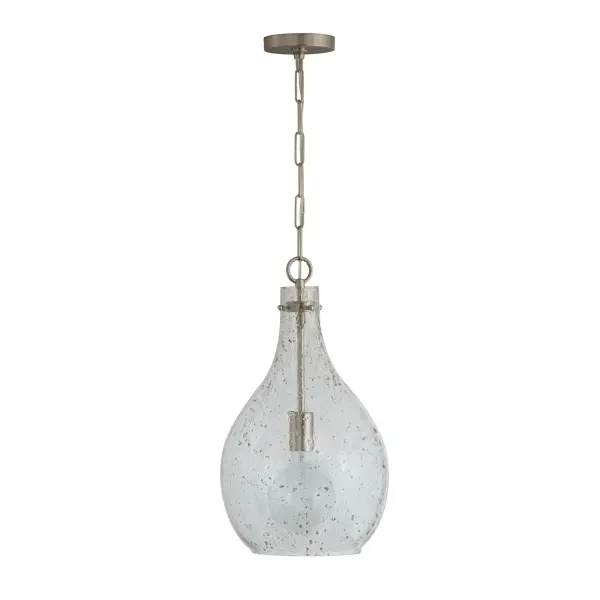 The Rabun pendant offers clean transitional styling in a compact 12-inch width, making it ideal for kitchen islands, breakfast nooks, and bathrooms. The brushed nickel finish provides timeless appeal.