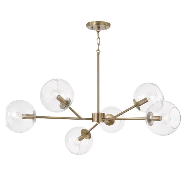 The Atlas 6-Light Chandelier brings refined elegance to large spaces with its 38-inch linear design and warm aged brass finish. Perfect for dining rooms and kitchen islands, this transitional fixture offers substantial illumination while maintaining a sleek, contemporary profile.