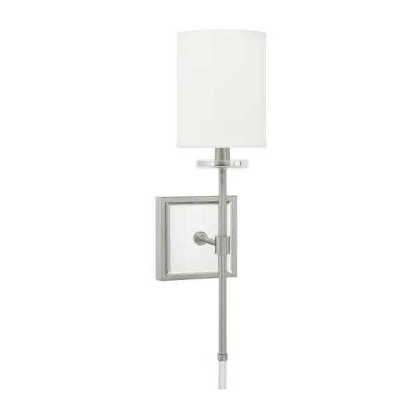 The Edin sconce delivers clean, contemporary style with its brushed nickel finish and compact 5-inch width. Ideal for flanking mirrors or illuminating hallways, this versatile fixture works in both residential and commercial settings.