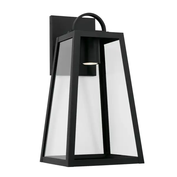 The Leighton outdoor wall lantern combines traditional styling with durable construction. Its 19.5-inch height and classic black finish make it ideal for illuminating entryways, porches, and patios with elegant charm.