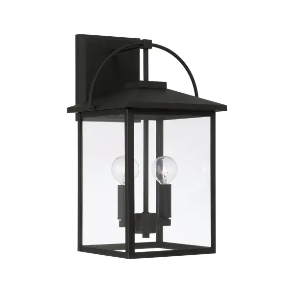 The Bryson 2-Light Outdoor Wall Lantern combines traditional lantern styling with durable outdoor construction. Its medium scale and classic black finish make it versatile for various exterior applications.