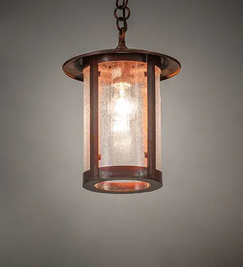 Handcrafted of Brass with exquisite beauty for both interior and outdoor lighting applications. This stunning cylindrical lantern features a Clear Seeded Glass lens revealing a single Edison-styled lamp; enhanced with a Vintage Copper finish. Overall height ranges from 20 to 48 inches as the chain length can be easily adjusted in the field. The Fulton Pendant is featured in our American-made; American-designed; handcrafted Craftsman Signature Series. Manufactured in Yorkville; New York. UL and cUL listed for dry and damp locations.
