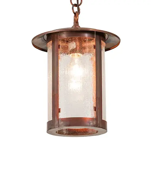 Handcrafted of Brass with exquisite beauty for both interior and outdoor lighting applications. This stunning cylindrical lantern features a Clear Seeded Glass lens revealing a single Edison-styled lamp; enhanced with a Vintage Copper finish. Overall height ranges from 20 to 48 inches as the chain length can be easily adjusted in the field. The Fulton Pendant is featured in our American-made; American-designed; handcrafted Craftsman Signature Series. Manufactured in Yorkville; New York. UL and cUL listed for dry and damp locations. - alternate view