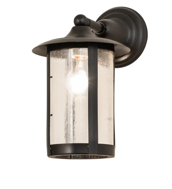 Handcrafted from Solid Brass with alluring rustic beauty. This stunning Craftsman Signature lantern features a Clear Seeded Glass lens enhanced with a Craftsman Brown finish. Mount this wall sconce directly to walls or facades to illuminate the exterior of timber homes; modern farmhouses; and other spaces. The Fulton Prime Solid Mount Wall Sconce is included in our American-made; American-designed; handcrafted Craftsman Signature Series; manufactured in Yorkville; New York. UL and cUL listed for dry; damp; and wet locations. Our Build Your Own Craftsman Signature Series features unlimited combinations of styles. The collection is called Build Your Own because it is fully configurable and customizable from size and design to finish and lens color. Marine grade; solid brass; or copper raw materials are utilized to ensure items from the Craftsman Signature Series of outdoor and indoor lighting will stand the test of time; as these premium metals are impervious to most types of oxidation. Hand-applied Patina finishes on brass and copper are sealed with a clear varnish and over time; may require gentle maintenance; such as wax; to delay or reverse the natural living finish attributes indicative of this finishing process. Patina finishes on brass and copper provide strong resistance to fading from sun exposure; will not chip or crack; and will not rust like a steel-framed item in the same conditions. Choose from many style options; or send us your concept today! Call today to learn how to use the configuration tool available on our website for an instant item number!