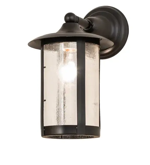 Handcrafted from Solid Brass with alluring rustic beauty. This stunning Craftsman Signature lantern features a Clear Seeded Glass lens enhanced with a Craftsman Brown finish. Mount this wall sconce directly to walls or facades to illuminate the exterior of timber homes; modern farmhouses; and other spaces. The Fulton Prime Solid Mount Wall Sconce is included in our American-made; American-designed; handcrafted Craftsman Signature Series; manufactured in Yorkville; New York. UL and cUL listed for dry; damp; and wet locations. Our Build Your Own Craftsman Signature Series features unlimited combinations of styles. The collection is called Build Your Own because it is fully configurable and customizable from size and design to finish and lens color. Marine grade; solid brass; or copper raw materials are utilized to ensure items from the Craftsman Signature Series of outdoor and indoor lighting will stand the test of time; as these premium metals are impervious to most types of oxidation. Hand-applied Patina finishes on brass and copper are sealed with a clear varnish and over time; may require gentle maintenance; such as wax; to delay or reverse the natural living finish attributes indicative of this finishing process. Patina finishes on brass and copper provide strong resistance to fading from sun exposure; will not chip or crack; and will not rust like a steel-framed item in the same conditions. Choose from many style options; or send us your concept today! Call today to learn how to use the configuration tool available on our website for an instant item number! - alternate view