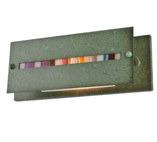 Inspired by naturally weathered stones on the path to a cozy cottage in the woods; Fused Glass tiles of autumnal colors are hand-set on a raised side panel of this Arts & Crafts styled vanity light. Behind the Fused Glass insets is a layer of Amber Mica to provide a unique decorative ambiance. The linear frame and raised panel are hand-finished in Tarnished Copper to create the signature look of American Bungalow. The fixture can be installed either vertically or horizontally to meet your lighting needs. Featured in the Moss Creek family; it is handcrafted by Meyda artisans in the Yorkville; New York manufacturing facilities.