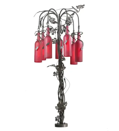 Capture the life of the party with the whimsical design of the Meyda Wine Bottle Table Lamp. Liven up a restaurant; club; or home with a table lamp that does so much more than deliver light; it adds personality and pizzazz. Seven Wine Bottles are featured in Frosted Red Glass and are suspended from Timeless Bronze finished arms; embraced by a table base with complementary metal leaf accents. Create a stunning design statement by directly mounting it to a J-Box and placing it on bars in homes; restaurants; hotels; pubs; nightclubs; and wineries. This lamp will be appreciated for its fine detail and charm by connoisseurs. This Tuscan Vineyard Red 7 Light Wine Bottle Table Lamp is included in our American-made; American-designed; handcrafted Wine Bottle Lighting Collection. The fixture is manufactured in Yorkville; New York. UL and cUL listed for dry and damp locations. Take your finest bottle of wine; and Meyda will transform it into an everlasting personalized fixture of light. Contact us for more information on custom wine bottle lighting fixtures and lamps. We can also create custom lighting with beer bottles; mason jars; milk bottles; and other glass containers and vessels.