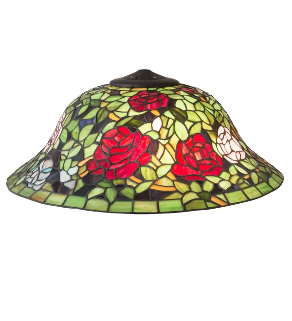 One of the most beloved of all floral beauties. The Rosebush is beautifully represented in this stunning lighting shade design that features beautiful Red and Pink art glass Roses ramble on a maze of Garden Green leaves with Bark Brown branches. This gorgeous shade is created using the famous Meyda Tiffany copperfoil construction. The delicate stained glass shade can be paired with a base to create a striking table or floor lamp; and matched with hardware to build a beautiful wall or ceiling fixture. The Tiffany Rosebush Shade is included in our American designed; handcrafted Tiffany Reproduction Collection. Each shade is a unique work of art with color variations based on natural ingredients inherent in the glass. Please contact us if color matching is critical when ordering multiple items.
