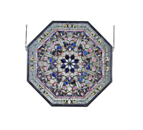 A magnificent octagon shaped stained glass window features various symmetric design repeats that branch out from a Cobalt and Clear Beveled glass eight-petaled flower in the central medallion. Victorian styled floral motifs with Red Roses blossom from natural Green and Golden stems among fanciful Beige scrollwork on backgrounds of Cobalt; Clear Iridescent and Clear Ripple glass. The design is trimmed with tilework borders in Dusty Rose; Leafy Greens and Rosy Reds and Cobalt on a Clear Ripple and Clear Iridescent glass trim with Lavender and Red jewels. The window features an Antique Brassfinished frame and includes hanging chains. - alternate view