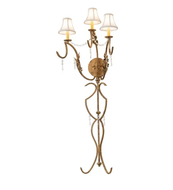 This nostalgic decorative wall sconce is ideal for theaters, restaurants, homes and hotels. Offering stunning embellishments and decorative accents, this fixture features handcrafted steel hardware finished in Light Brushed Gold and complemented with Tan Linen fabric shades.Energy efficient lamping options available. Custom crafted in our Yorkville, New York manufacturing facility. Collection: Old Broadway Finish: Light Brushed Gold Glass: Cream Textrene Width: 21.00" Height: 59.00" Length: 15.00" Weight: 40.00 lb Extension from Wall: 14.75" Number of Bulbs: 3 Maximum Wattage: 60.00 W Bulb Type: B10 Bulb Base: E12 Material: Steel/Crystal Country of Origin: USA Safety Listing: Damp Safety Rating: Damp