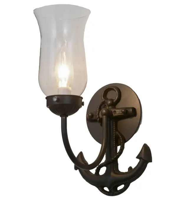 Anchors away. Nautical charm meets traditional styling with this wall sconce. A rugged steel Anchor designed backplate is finished in Wrought Iron and illuminated with a Clear Hurricane styled glass shade. This fixture is custom crafted by Meyda artisans in Upstate New York. Custom colors, styles and sizes are available. Collection: Anchor Finish: Wrought Iron Glass: Clear Glass Width: 6.00" Height: 11.50" Length: 8.00" Weight: 2.50 lb Extension from Wall: 8.00" Number of Bulbs: 1 Maximum Wattage: 40.00 W Bulb Type: B10 Bulb Base: E12 Material: Steel Country of Origin: USA Safety Listing: Damp Safety Rating: Damp
