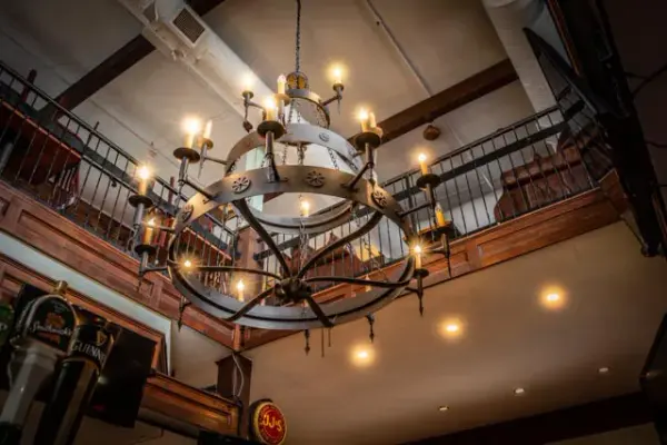 Bring the Gothic Revival into your home with MeydaLighting's elaborate Warwick Chandelier, which integrates a rustic Motif with gothic style. Faux candles perched atop holders on three rings featuring spearhead accents, provide lighting that conjures up images of romanticized bygone days. Decorated with cast iron medallions and coated with a Dark Roast finish, it completes the evocative impression. Custom crafted in Yorkville, New York by Meyda artisans. Collection: Warwick Finish: Dark Roast Glass: Sunflower,Amber,Chocolate,White Width: 72.00" Height: 77.00" Length: 72.00" Number of Bulbs: 21 Maximum Wattage: 60.00 W Bulb Type: A19 Bulb Base: E26 Material: Steel Country of Origin: USA Safety Listing: Damp Safety Rating: Damp - alternate view