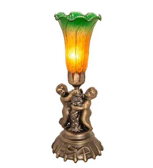 Inspired by the famous Tiffany design from the early 1900s. This mini lamp features a stunning shade mouth blown of Amber and Green art glass. The Pond Lily shade is embraced by an elegant cast base featuring two cherubs finished by hand in Antique Brass. The Pond Lily Mini Lamp is featured in our American designed; handcrafted Favrile Glass Collection. UL and cUL listed for dry locations. Each shade is a unique work of art with color variations based on natural ingredients inherent in the glass. Contact us if color matching is critical when ordering multiple items. - alternate view